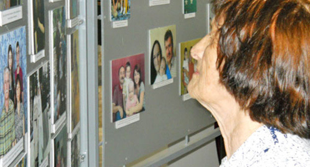 Exhibition dedicated to Repatriate's Day held in Maikop; visitor are reviewing the photos; Republic of Adygea, Maikop, July 30, 2012. Photo by Oleg Chaly for the "Caucasian Knot" Exhibition dedicated to Repatriate's Day held in Maikop; visitor are reviewing the photos; Republic of Adygea, Maikop, July 30, 2012. Photo by Oleg Chaly for the "Caucasian Knot"