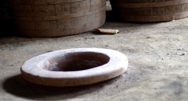 Neck of the traditional vessel named kvevri and used for storing wine is immersed and fixed in the floor, Georgia, Marneuli. Photo: Susan Astray, http://www.flickr.com/photos/susanastray Neck of the traditional vessel named kvevri and used for storing wine is immersed and fixed in the floor, Georgia, Marneuli. Photo: Susan Astray, http://www.flickr.com/photos/susanastray