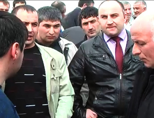 Meeting of "Belaya Rechka" villagers with the requirement to allocate the land plots earlier granted into lease for housing construction; March 16, 2013; still from the video "March 16, 2013; Belaya Rechka (KBR); land defence" by the user debet13 on http://www.youtube.com Meeting of "Belaya Rechka" villagers with the requirement to allocate the land plots earlier granted into lease for housing construction; March 16, 2013; still from the video "March 16, 2013; Belaya Rechka (KBR); land defence" by the user debet13 on http://www.youtube.com
