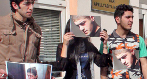 Group of young activists holding a silent protest action in front of the AppealCourt by sticking photos of Mamed Azizov to their clothes;Baku, February 27, 2013. Photo by Parvana Bairamova for the "Caucasian Knot" Group of young activists holding a silent protest action in front of the AppealCourt by sticking photos of Mamed Azizov to their clothes;Baku, February 27, 2013. Photo by Parvana Bairamova for the "Caucasian Knot"