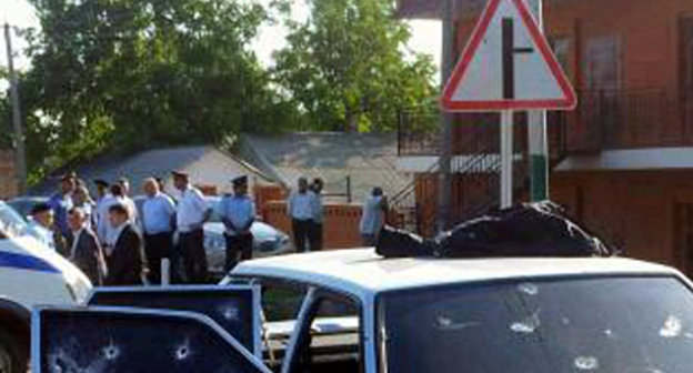 At the car where Akhmed Kotiev was killed. Ingushetia, Malgobek District, Nizhnie Achaluki. August 27, 2013. Photo by press-service of Ingush MIA, 06.mvd.ru At the car where Akhmed Kotiev was killed. Ingushetia, Malgobek District, Nizhnie Achaluki. August 27, 2013. Photo by press-service of Ingush MIA, 06.mvd.ru