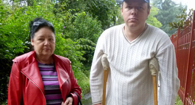 The Tsentralny District Court of Sochi has ruled to deport Vladimir Dolidze, a person with the passport of a citizen of the USSR, who needs specialized medical care, to Georgia. In the photo: Vladimir Dolidze and his mother Svetlana Dolidze. Sochi, October, 2013. Photo by Svetlana Kravchenko for the "Caucasian Knot" The Tsentralny District Court of Sochi has ruled to deport Vladimir Dolidze, a person with the passport of a citizen of the USSR, who needs specialized medical care, to Georgia. In the photo: Vladimir Dolidze and his mother Svetlana Dolidze. Sochi, October, 2013. Photo by Svetlana Kravchenko for the "Caucasian Knot"