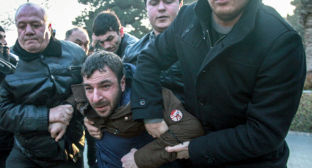 Police detains youth activists at the protest action in Baku on December 29, 2013. Photo by Aziz Karimov for the "Caucasian Knot" Police detains youth activists at the protest action in Baku on December 29, 2013. Photo by Aziz Karimov for the "Caucasian Knot"
