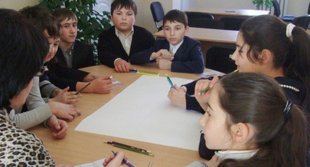 Schoolchildren from seven Ossetian and Ingush schools of the Prigorodny District of North Ossetia took part in the children's New Year party. Oktyabrskoe village, December 25, 2013. Photo provided by Yulia Chardina, the leader of the project "Harmonization of Interethnic Relations in Prigorodny District through small business development". Schoolchildren from seven Ossetian and Ingush schools of the Prigorodny District of North Ossetia took part in the children's New Year party. Oktyabrskoe village, December 25, 2013. Photo provided by Yulia Chardina, the leader of the project "Harmonization of Interethnic Relations in Prigorodny District through small business development".