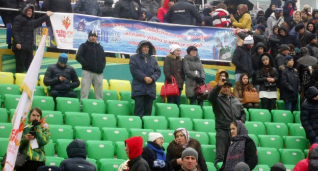 Spectators in the stalls of of the "Anji Arena" during the ceremony of honouring the Olympic Flame. Dagestan, January 27, 2014. Photo http://www.anji-arena.ru/olimpijskij-ogon-na-anzhi-arene/ Spectators in the stalls of of the "Anji Arena" during the ceremony of honouring the Olympic Flame. Dagestan, January 27, 2014. Photo http://www.anji-arena.ru/olimpijskij-ogon-na-anzhi-arene/
