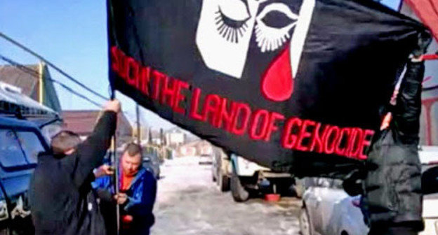 Flag of the rally against Sochi Olympics, Nalchik, February 7, 2014. Screenshot from video http://bambuser.com/ Flag of the rally against Sochi Olympics, Nalchik, February 7, 2014. Screenshot from video http://bambuser.com/