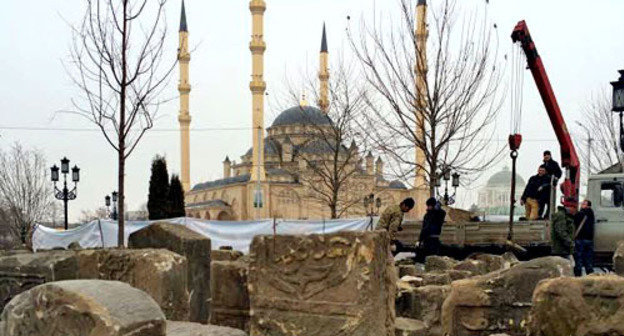 The gravestones monuments, which constituted the main part of the composition of the Memorial to victims of the deportation in 1944, are transferred to the territory of the complex, dedicated to the memory of the fallen employees of the Chechen power structures, located in Akhmat Kadyrov Square. Grozny, February 14, 2014. Photo by an eyewitness The gravestones monuments, which constituted the main part of the composition of the Memorial to victims of the deportation in 1944, are transferred to the territory of the complex, dedicated to the memory of the fallen employees of the Chechen power structures, located in Akhmat Kadyrov Square. Grozny, February 14, 2014. Photo by an eyewitness