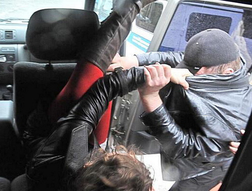 Detention of Pussy Riot members in Sochi on February 18, 2014. Photo from the Twitter account of ‘Voina’ group activists, http://twitter.com/gruppa_voina/status/435830304725794816/ Detention of Pussy Riot members in Sochi on February 18, 2014. Photo from the Twitter account of ‘Voina’ group activists, http://twitter.com/gruppa_voina/status/435830304725794816/