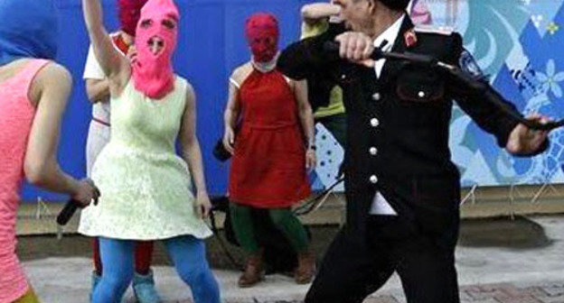 A brawl between Cossaks and Pussy Riot band and the art-group "Voina" members. Sochi, February 19, 2014. Photo from activists’ Twitter account, http://twitter.com/gruppa_voina/status/435830304725794816/ A brawl between Cossaks and Pussy Riot band and the art-group "Voina" members. Sochi, February 19, 2014. Photo from activists’ Twitter account, http://twitter.com/gruppa_voina/status/435830304725794816/