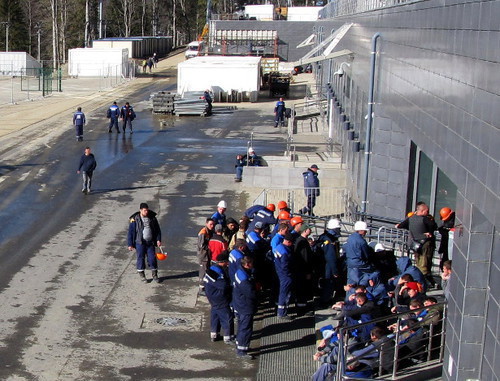 Builders during lunch break. Sochi, ‘Laura’ Biathlon Complex, November 21, 2013. Photo by Tatiana Ukolova for the ‘Caucasian Knot’. Builders during lunch break. Sochi, ‘Laura’ Biathlon Complex, November 21, 2013. Photo by Tatiana Ukolova for the ‘Caucasian Knot’.