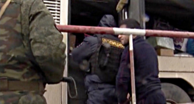 Temporary Interservice Team holding inspection or intercity bus. Volgograd Region, Svetloyarsk District, Bolshie Chapurniki village, January 2014. Screenshot from the video of Volgograd Region MIA press-service, http://34mvd.ru/news/item/1826526/ Temporary Interservice Team holding inspection or intercity bus. Volgograd Region, Svetloyarsk District, Bolshie Chapurniki village, January 2014. Screenshot from the video of Volgograd Region MIA press-service, http://34mvd.ru/news/item/1826526/