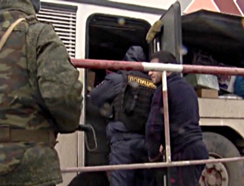 Temporary Interservice Team holding inspection or intercity bus. Volgograd Region, Svetloyarsk District, Bolshie Chapurniki village, January 2014. Screenshot from the video of Volgograd Region MIA press-service, http://34mvd.ru/news/item/1826526/ Temporary Interservice Team holding inspection or intercity bus. Volgograd Region, Svetloyarsk District, Bolshie Chapurniki village, January 2014. Screenshot from the video of Volgograd Region MIA press-service, http://34mvd.ru/news/item/1826526/