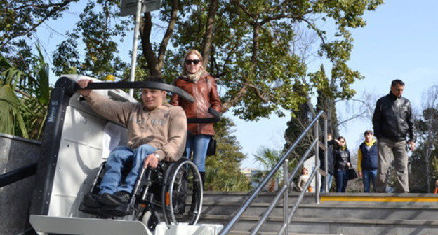 Flor Vladimirov testing new lift for wheelchairs in pedestrian underpass at ‘Moscow’ hotel in Kurortny Avenue. Sochi, March 9, 2014. Photo by Svetlana Kravchenko for the ‘Caucasian Knot’. Flor Vladimirov testing new lift for wheelchairs in pedestrian underpass at ‘Moscow’ hotel in Kurortny Avenue. Sochi, March 9, 2014. Photo by Svetlana Kravchenko for the ‘Caucasian Knot’.