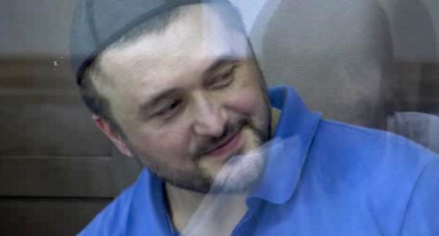 Rustam Makhmudov accused of the murder of Anna Politkovskaya, in the courtroom. June 4, 2013. Screenshot of a video by the press service of the Moscow City Court, http://www.mos-gorsud.ru/video/sudzs/?pn=0&id=168 Rustam Makhmudov accused of the murder of Anna Politkovskaya, in the courtroom. June 4, 2013. Screenshot of a video by the press service of the Moscow City Court, http://www.mos-gorsud.ru/video/sudzs/?pn=0&id=168
