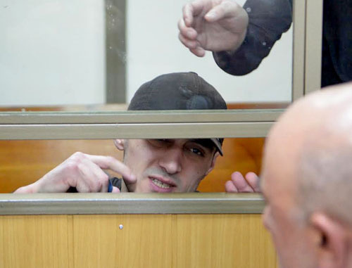 Convicted Yusup Dzangiev talks to his father in the courtroom in the North-Caucasian District Military Court. Rostov-on-Don, April 8, 2014. Photo by Oleg Pchelov for the "Caucasian Knot" Convicted Yusup Dzangiev talks to his father in the courtroom in the North-Caucasian District Military Court. Rostov-on-Don, April 8, 2014. Photo by Oleg Pchelov for the "Caucasian Knot"