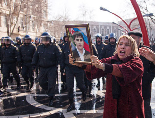 Azerbaijani woman holding portrait of the perished soldier during the rally against non-combat losses in the Army. Baku, March 10, 2013. Photo by Aziz Karimov for the ‘Caucasian Knot’. Azerbaijani woman holding portrait of the perished soldier during the rally against non-combat losses in the Army. Baku, March 10, 2013. Photo by Aziz Karimov for the ‘Caucasian Knot’.