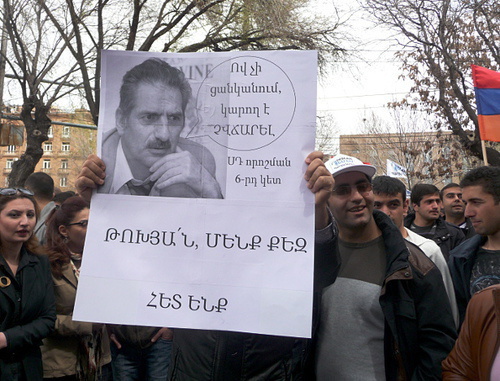 Participants of action against pension reform holding banners with the portrait of the Constitutional Court judge Felix Tokhyan. The banner says: “CC decision, clause 6: those who doesn’t want to pay can’t by obliged to do it”, “Tokhyan, we are with you!”. Yerevan, April 9, 2014. Photo by Armine Martirosyan for the ‘Caucasian Knot’. Participants of action against pension reform holding banners with the portrait of the Constitutional Court judge Felix Tokhyan. The banner says: “CC decision, clause 6: those who doesn’t want to pay can’t by obliged to do it”, “Tokhyan, we are with you!”. Yerevan, April 9, 2014. Photo by Armine Martirosyan for the ‘Caucasian Knot’.