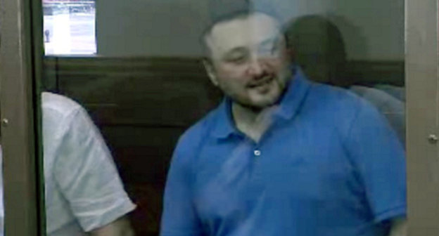 Rustam Makhmudov, accused of committing the murder of Anna Politkovskaya, at the court session on June 6, 2013. Screenshot of a video by the press service of the Moscow City Court, http://www.mos-gorsud.ru/ Rustam Makhmudov, accused of committing the murder of Anna Politkovskaya, at the court session on June 6, 2013. Screenshot of a video by the press service of the Moscow City Court, http://www.mos-gorsud.ru/
