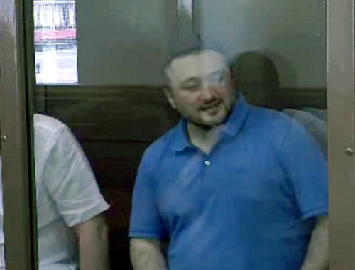 Rustam Makhmudov, accused of committing the murder of Anna Politkovskaya, at the court session on June 6, 2013. Screenshot of a video by the press service of the Moscow City Court, http://www.mos-gorsud.ru/ Rustam Makhmudov, accused of committing the murder of Anna Politkovskaya, at the court session on June 6, 2013. Screenshot of a video by the press service of the Moscow City Court, http://www.mos-gorsud.ru/