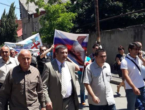 Demonstration in support of restoration of the diplomatic relations with Russia, organised by the NPO coalition "Eurasian Choice-Georgia". Archil Chkoidze, the leader of the coalition, is second from the left. Tbilisi, May 28, 2014. Photo by Maya Khingachashvili, https://www.facebook.com/achiko.chkoidze/photos Demonstration in support of restoration of the diplomatic relations with Russia, organised by the NPO coalition "Eurasian Choice-Georgia". Archil Chkoidze, the leader of the coalition, is second from the left. Tbilisi, May 28, 2014. Photo by Maya Khingachashvili, https://www.facebook.com/achiko.chkoidze/photos