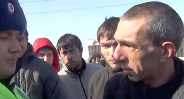 Andzor Akhokhov (to the right) talks to a law enforcer at the anti-Olympic action. Nalchik, February 7, 2014. Screenshot of a video "NO SOCHI. Cherkessia. Kabarda. 07.02.14" uploaded to the videohosting YouTube by the user Cherkes Cherkessia, http://www.youtube.com/watch?v=SiVpnRFrurc Andzor Akhokhov (to the right) talks to a law enforcer at the anti-Olympic action. Nalchik, February 7, 2014. Screenshot of a video "NO SOCHI. Cherkessia. Kabarda. 07.02.14" uploaded to the videohosting YouTube by the user Cherkes Cherkessia, http://www.youtube.com/watch?v=SiVpnRFrurc