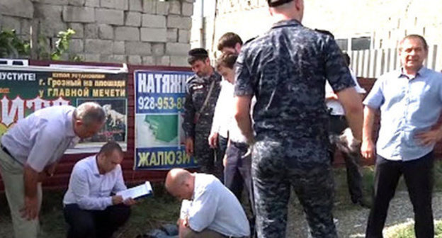 Law enforcers at the place of the killing of the accused of murder of the policeman. Grozny, July 3, 2014. Screenshot of a video of the press service of the Ministry of Internal Affairs (MIA) of Chechnya Law enforcers at the place of the killing of the accused of murder of the policeman. Grozny, July 3, 2014. Screenshot of a video of the press service of the Ministry of Internal Affairs (MIA) of Chechnya