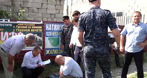 Law enforcers at the place of the killing of the accused of murder of the policeman. Grozny, July 3, 2014. Screenshot of a video of the press service of the Ministry of Internal Affairs (MIA) of Chechnya Law enforcers at the place of the killing of the accused of murder of the policeman. Grozny, July 3, 2014. Screenshot of a video of the press service of the Ministry of Internal Affairs (MIA) of Chechnya