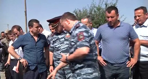 Law enforcers at the place where suspect in police officer’s murder was shot. Grozny, July 3, 2014. Screenshot from the video taken by press-service of Chechen MIA. Law enforcers at the place where suspect in police officer’s murder was shot. Grozny, July 3, 2014. Screenshot from the video taken by press-service of Chechen MIA.