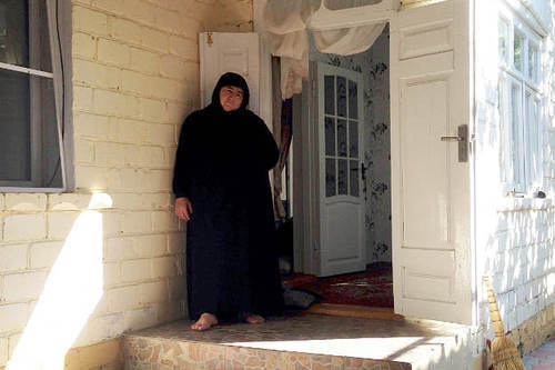 The village of Maidanskoe, Untsukul District of Dagestan, July 2014. Ayna Gamzatova, mother of the villager Magomed Payzulaev killed during the special operation on July 6, 2014, in the door of her house. Photo by Makhach Akhmedov for the "Caucasian Knot" The village of Maidanskoe, Untsukul District of Dagestan, July 2014. Ayna Gamzatova, mother of the villager Magomed Payzulaev killed during the special operation on July 6, 2014, in the door of her house. Photo by Makhach Akhmedov for the "Caucasian Knot"