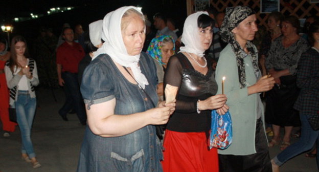 South Ossetia, Tskhinvali, night of August 7-8, 2014, sacred procession at the Temple of Nativity of the Blessed Virgin in commemoration of the 6th anniversary of the 2008 War. Photo by Maria Kotaeva for the ‘Caucasian Knot’. South Ossetia, Tskhinvali, night of August 7-8, 2014, sacred procession at the Temple of Nativity of the Blessed Virgin in commemoration of the 6th anniversary of the 2008 War. Photo by Maria Kotaeva for the ‘Caucasian Knot’.