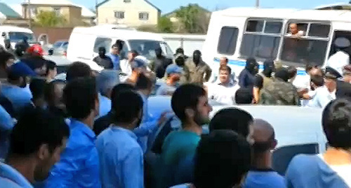 Detention of mosque-goers in Derbent, law enforcers in masks are seen at the distance shot. Photo: screenshot of a video by the "Caucasian Knot", http://www.youtube.com/watch?v=IHROnkYUH-0 Detention of mosque-goers in Derbent, law enforcers in masks are seen at the distance shot. Photo: screenshot of a video by the "Caucasian Knot", http://www.youtube.com/watch?v=IHROnkYUH-0