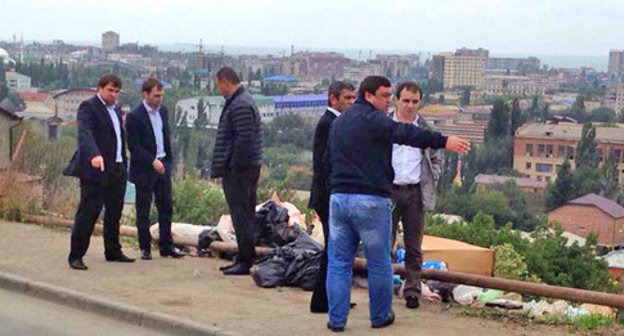 The heads of the administration of the Soviet District Court of Makhachkala inspect sanitary state of the platform containers and adjacent territory. Dagestan, October 2014. Photo: the official site of the administration of Makhachkalan http://www.mkala.ru/ The heads of the administration of the Soviet District Court of Makhachkala inspect sanitary state of the platform containers and adjacent territory. Dagestan, October 2014. Photo: the official site of the administration of Makhachkalan http://www.mkala.ru/