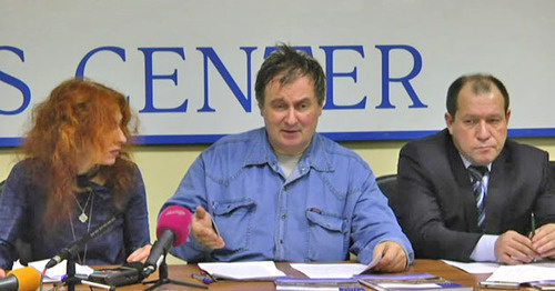 Tatyana Lokshina, Alexander Cherkasov and Igor Kalyapin (to the right) during a press conference on the topic "Collective punishment as a method of dealing with armed underground in Chechnya". Moscow, December 11, 2014. Screenshot of a video by a user "Radio Svoboda" https://www.youtube.com Tatyana Lokshina, Alexander Cherkasov and Igor Kalyapin (to the right) during a press conference on the topic "Collective punishment as a method of dealing with armed underground in Chechnya". Moscow, December 11, 2014. Screenshot of a video by a user "Radio Svoboda" https://www.youtube.com