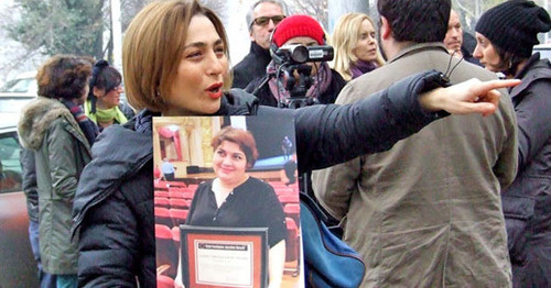 Nino Daneliya, a participant of the action, holds a poster with the photo of the journalist Khadija Ismayilova. Tbilisi, December 10, 2014. Photo by Edita Badasyan for the "Caucasian Knot Nino Daneliya, a participant of the action, holds a poster with the photo of the journalist Khadija Ismayilova. Tbilisi, December 10, 2014. Photo by Edita Badasyan for the "Caucasian Knot