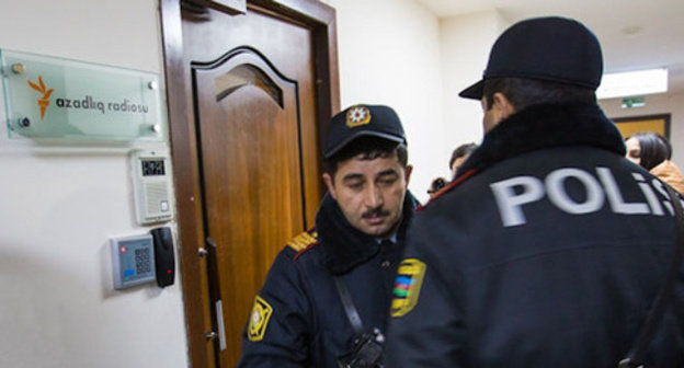 Law enforcer at the door of the office of the Radio Liberty. Baku, December 26, 2014. Photo by the "Caucasian Knot" Law enforcer at the door of the office of the Radio Liberty. Baku, December 26, 2014. Photo by the "Caucasian Knot"