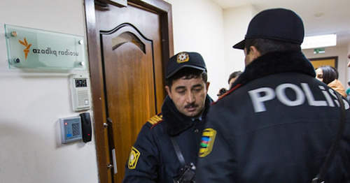 Law enforcer at the door of the office of the Radio Liberty. Baku, December 26, 2014. Photo by the "Caucasian Knot" Law enforcer at the door of the office of the Radio Liberty. Baku, December 26, 2014. Photo by the "Caucasian Knot"