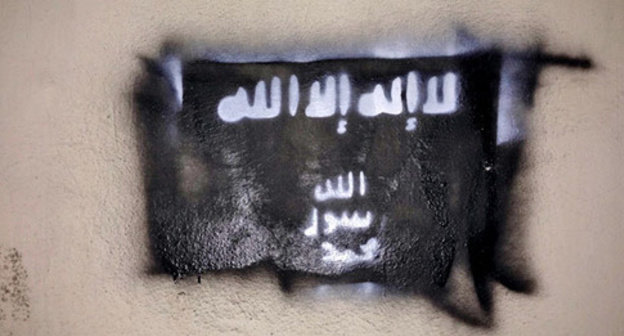 A flag of the ISIL (recognized on December 29, 2014, by the Supreme Court of the Russian Federation as a terrorist organization) on the wall of one of the buildings in Grozny. Chechnya, February 10, 2015. Photo by the "Caucasian Knot" A flag of the ISIL (recognized on December 29, 2014, by the Supreme Court of the Russian Federation as a terrorist organization) on the wall of one of the buildings in Grozny. Chechnya, February 10, 2015. Photo by the "Caucasian Knot"