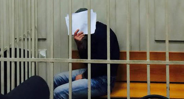 Anzor Gubashev shut his face from TV cameras and press photographers in the Basmanny Court room, March 8, 2015. Photo by Yuliya Buslavskaya for the "Caucasian Knot" Anzor Gubashev shut his face from TV cameras and press photographers in the Basmanny Court room, March 8, 2015. Photo by Yuliya Buslavskaya for the "Caucasian Knot"