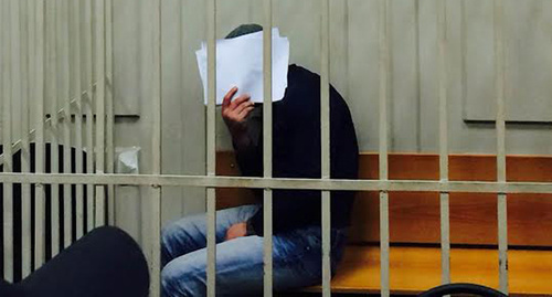 Anzor Gubashev shut his face from TV cameras and press photographers in the Basmanny Court room, March 8, 2015. Photo by Yuliya Buslavskaya for the "Caucasian Knot" Anzor Gubashev shut his face from TV cameras and press photographers in the Basmanny Court room, March 8, 2015. Photo by Yuliya Buslavskaya for the "Caucasian Knot"
