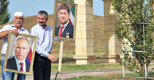 The residents of Chechnya with the portraits of Kadyrov and Putin at the meeting in Grozny. Photo by Akhmed Aldebirov for the "Caucasian Knot" The residents of Chechnya with the portraits of Kadyrov and Putin at the meeting in Grozny. Photo by Akhmed Aldebirov for the "Caucasian Knot"