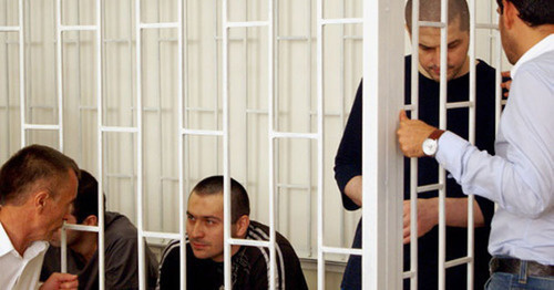 The defendants in the case of the terror act, which killed Sheikh Said Afandi al-Chirkawi and their advocates at the court session. Makhachkala, July 30, 2014. Photo by Aida Magomedova for the "Caucasian Knot" The defendants in the case of the terror act, which killed Sheikh Said Afandi al-Chirkawi and their advocates at the court session. Makhachkala, July 30, 2014. Photo by Aida Magomedova for the "Caucasian Knot"