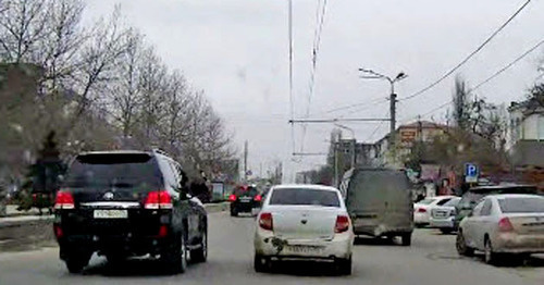 The security guard from the jeep of the convoy of the head of the republic Ramazan Abdulatipov beating the side mirrors of the surrounding cars with a police truncheon. Makhachkala, April 1, 2015. Screenshot of a video by the user MishkaKG http://www.youtube.com/watch?v=GZzEzujUah8 The security guard from the jeep of the convoy of the head of the republic Ramazan Abdulatipov beating the side mirrors of the surrounding cars with a police truncheon. Makhachkala, April 1, 2015. Screenshot of a video by the user MishkaKG http://www.youtube.com/watch?v=GZzEzujUah8