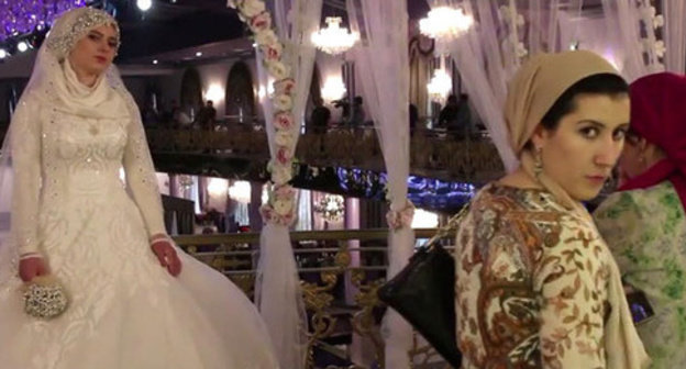 Wedding of the chief of the ROVD of the Nozhai-Yurt District of Chechnya with a 17-year-old girl. Grozny, May 16, 2015. Screenshot of a video by the user Caucasian Policy https://www.youtube.com/watch?v=2xpRgf28g90 Wedding of the chief of the ROVD of the Nozhai-Yurt District of Chechnya with a 17-year-old girl. Grozny, May 16, 2015. Screenshot of a video by the user Caucasian Policy https://www.youtube.com/watch?v=2xpRgf28g90