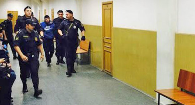 The law enforcers lead Zaur Dadaev through the corridor of the Basmanny District Court of Moscow. May 2015. Photo by the "Caucasian Knot" correspondent The law enforcers lead Zaur Dadaev through the corridor of the Basmanny District Court of Moscow. May 2015. Photo by the "Caucasian Knot" correspondent