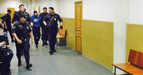 The law enforcers lead Zaur Dadaev through the corridor of the Basmanny District Court of Moscow. May 2015. Photo by the "Caucasian Knot" correspondent The law enforcers lead Zaur Dadaev through the corridor of the Basmanny District Court of Moscow. May 2015. Photo by the "Caucasian Knot" correspondent
