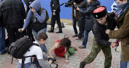 A brawl between Cossaks and Pussy Riot band. Photo by Mikhail Mordasov, Yugopolis. A brawl between Cossaks and Pussy Riot band. Photo by Mikhail Mordasov, Yugopolis.