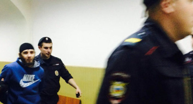 Law enforcers lead Zaur Dadaev through the corridor of the Basmanny District Court of Moscow. May 2015. Photo by Yulia Buslavskaya for the ‘Caucasian Knot’. Law enforcers lead Zaur Dadaev through the corridor of the Basmanny District Court of Moscow. May 2015. Photo by Yulia Buslavskaya for the ‘Caucasian Knot’.