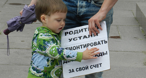A child at the protest action, May 30, 2015. Photo by Tatiana Filimonova for the ‘Caucasian Knot’. A child at the protest action, May 30, 2015. Photo by Tatiana Filimonova for the ‘Caucasian Knot’.