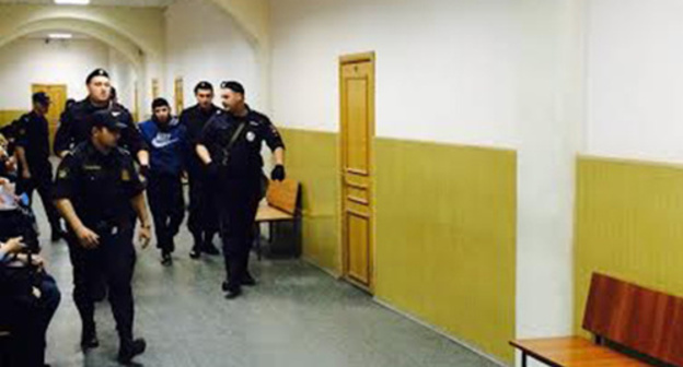 Dadaev is lead to the courtroom, May 13, 2015. Photo by Yuliya Buslavskaya for the "Caucasian Knot" Dadaev is lead to the courtroom, May 13, 2015. Photo by Yuliya Buslavskaya for the "Caucasian Knot"
