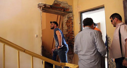 Broken door in the office of the Committee against Torture.